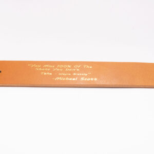 Product image of FredFloris leather bookmark with quotes, heat pressed with gold foil