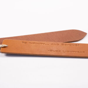 Product image of FredFloris leather bookmark with quotes, heat pressed without gold foil