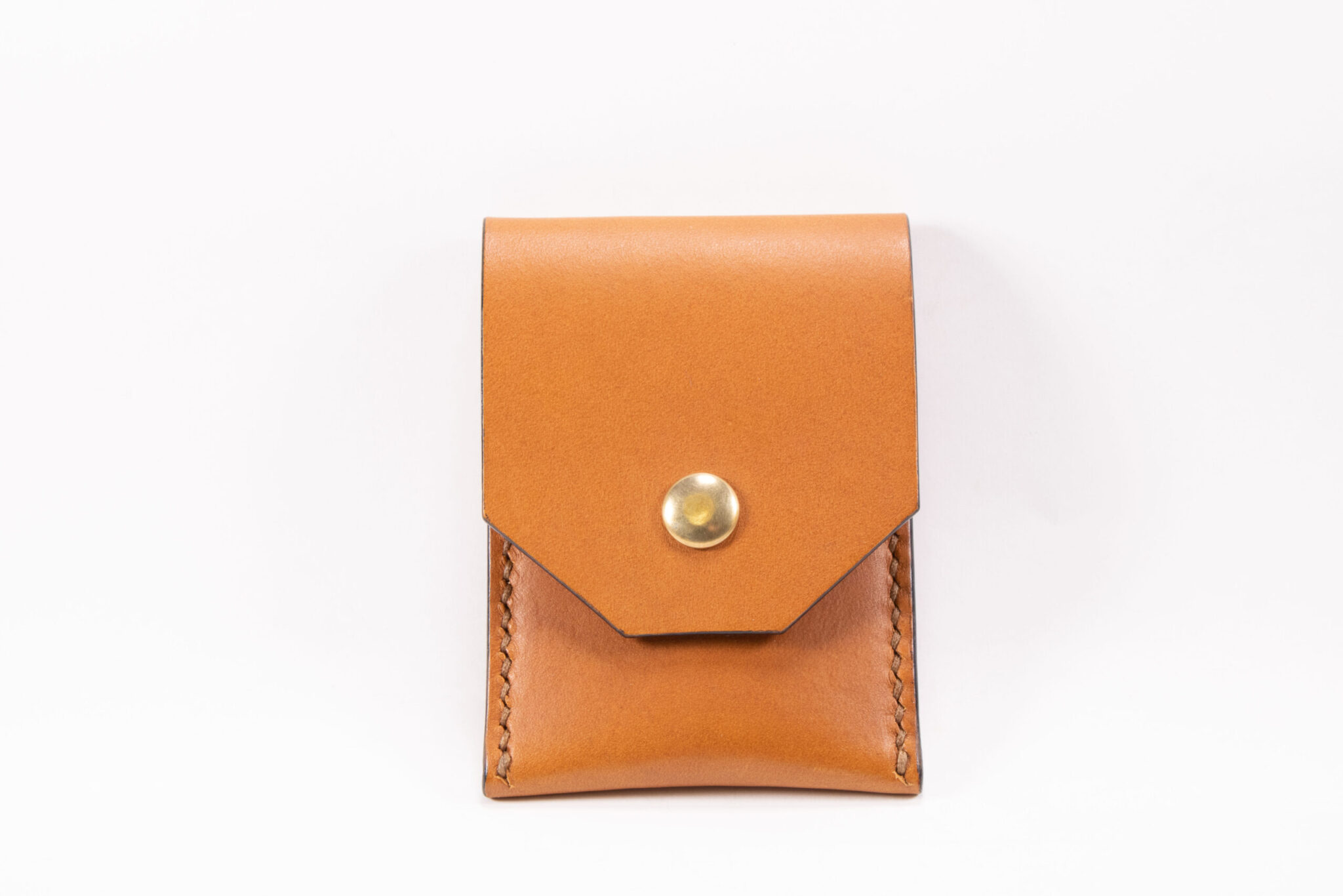 Tinier Pouch - Slim pocket card wallets Handmade from European Leather. 4-8 card wallets made from Vegetable-tanned leather available in cognac color. Sizes 70 mm & 80mm wallet leather made in Sweden.