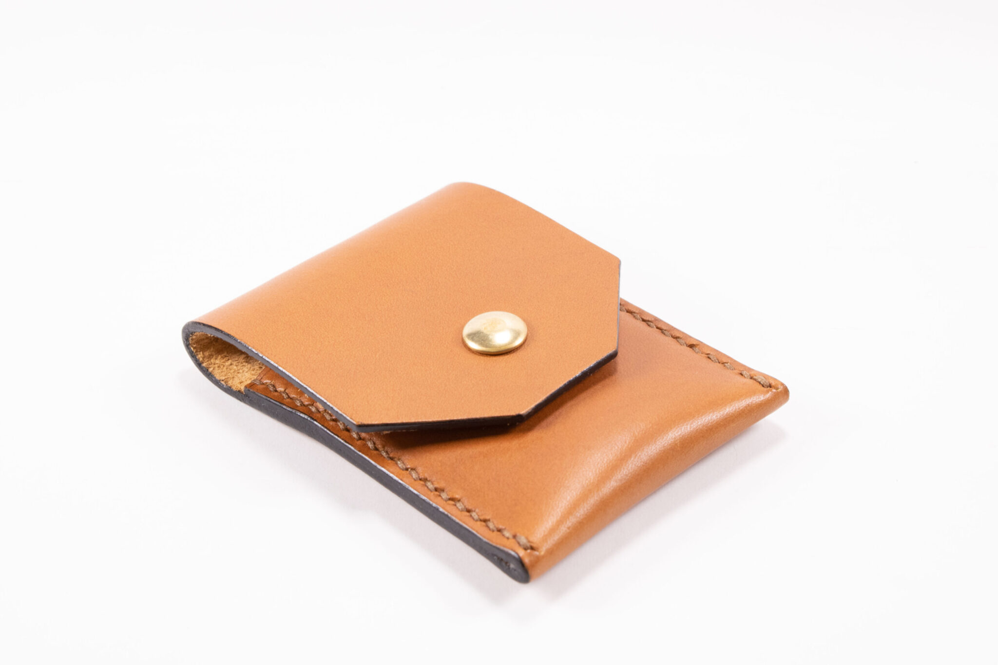 Tinier Pouch - Slim pocket card wallets Handmade from European Leather. 4-8 card wallets made from Vegetable-tanned leather available in cognac color. Sizes 70 mm & 80mm wallet leather made in Sweden.