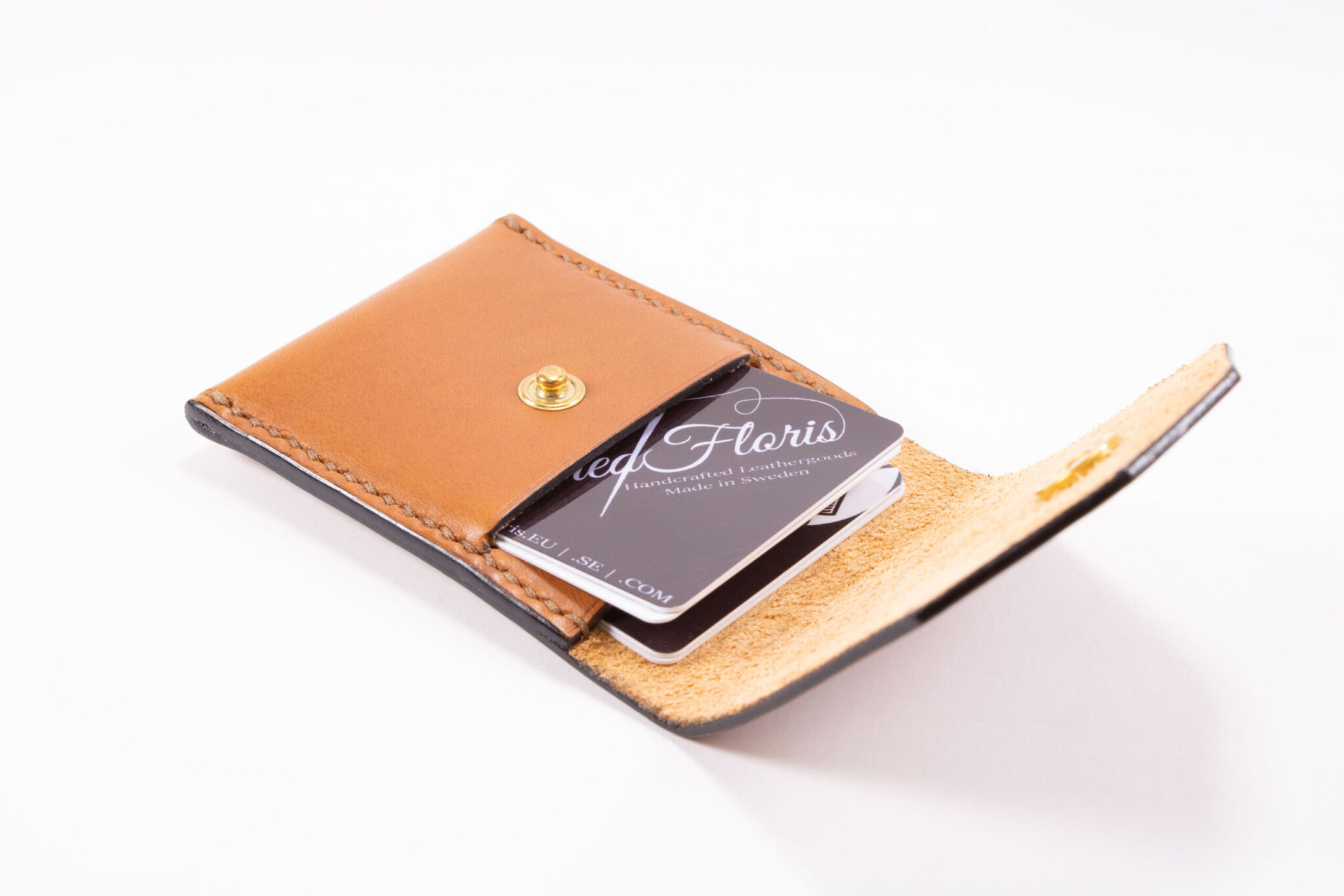 Tinier Pouch - Slim pocket card wallets Handmade from European Leather. 4-8 card wallets made from Vegetable-tanned leather available in cognac color. Sizes 70 mm & 80mm wallet leather made in Sweden.