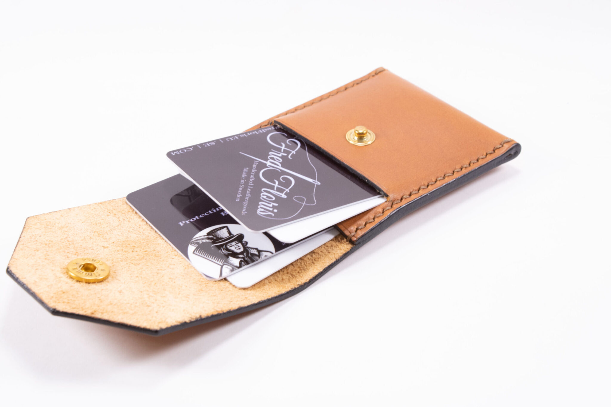 Tinier Pouch - Slim pocket card wallets Handmade from European Leather. 4-8 card wallets made from Vegetable-tanned leather available in cognac color. Sizes 70 mm & 80mm wallet leather made in Sweden.