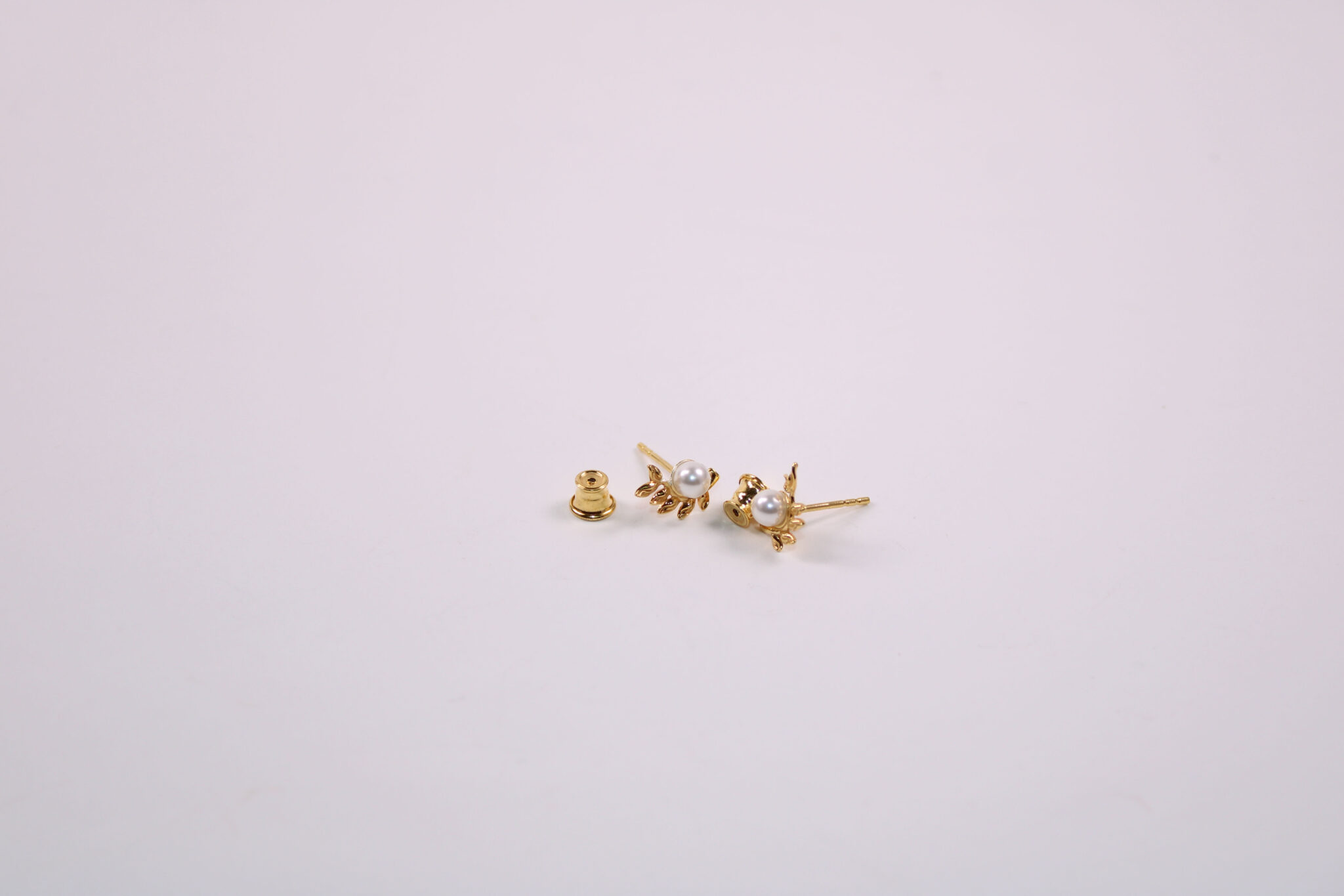 Product image of FredFloris small stud gold plated silver pearl earrings