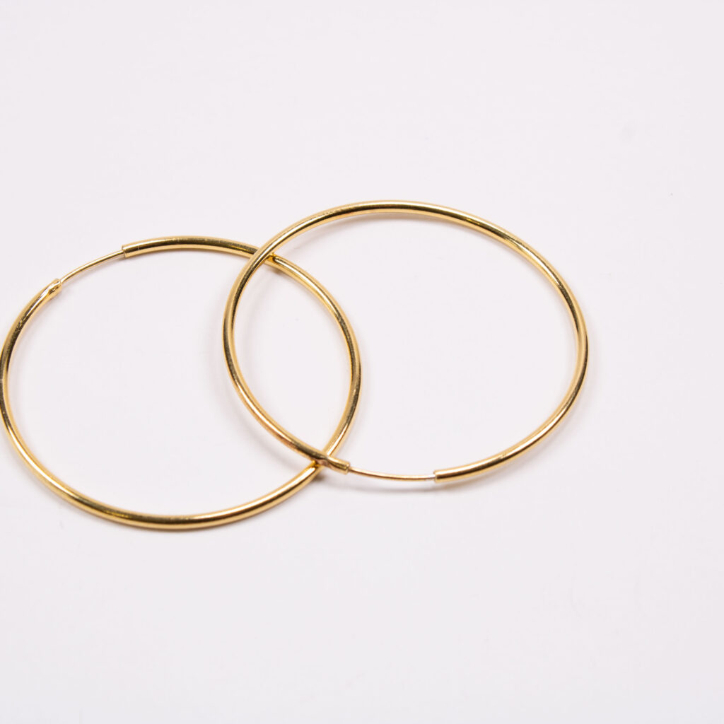 Product image of FredFloris large round hoop gold and silver earrings