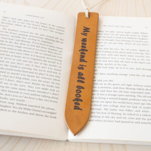 Laser engraved leather bookmark made from Full-grain European Leather made in Sweden tanned in Italy. Choose your own font and text size for a custom bookmark