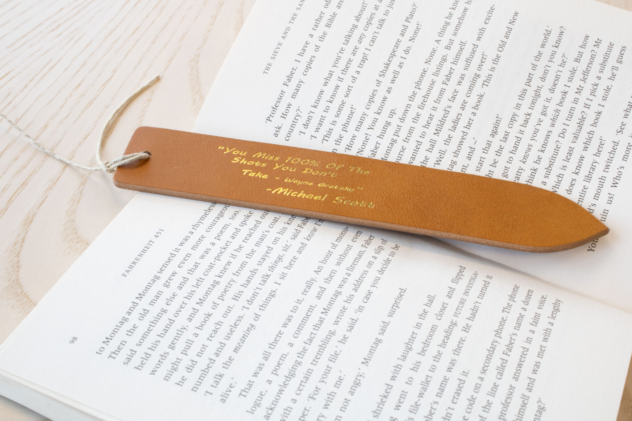 Product image of FredFloris leather bookmark with quotes, heat pressed with gold foil