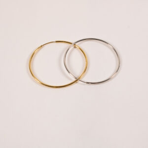 Product image of FredFloris large round hoop gold and silver earrings